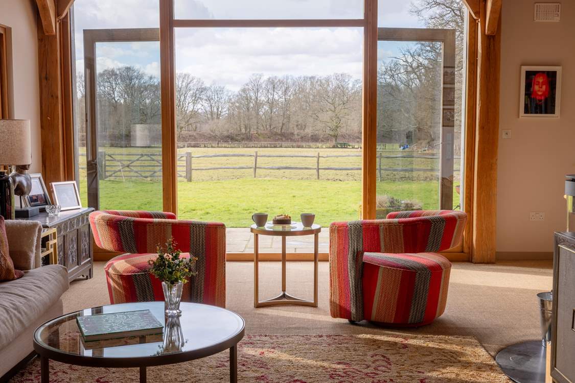 Double doors from the living area open to the patio and garden.