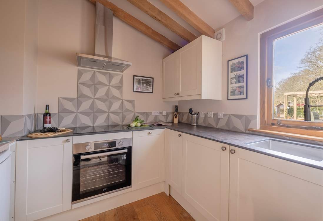Cook up a sumptuous supper in this compact, but well-equipped kitchen.