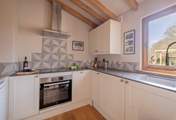 Cook up a sumptuous supper in this compact, but well-equipped kitchen.