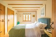 The two king-size bedrooms are tucked away towards the back of the barn.
