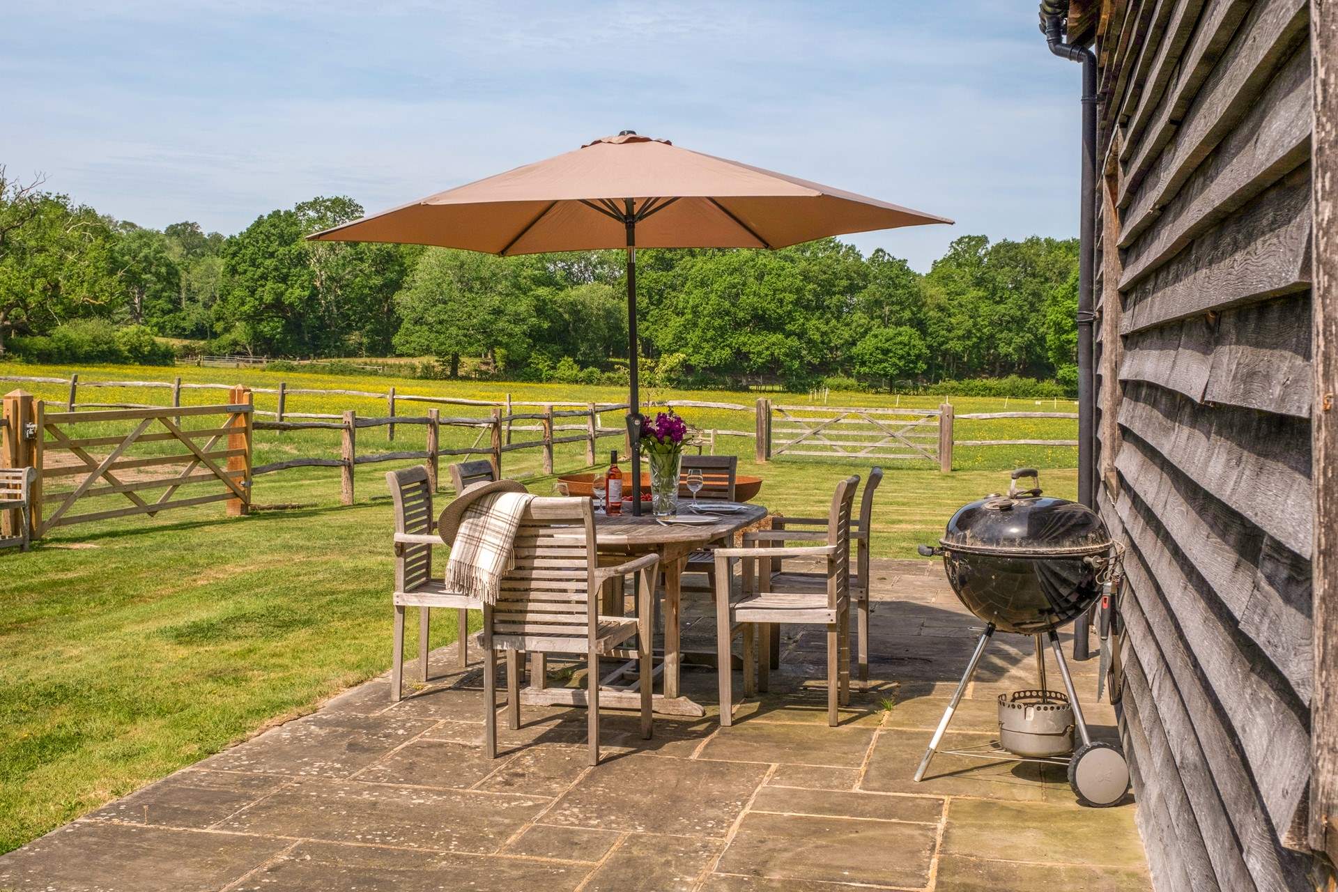 The patio area beside the barn is very private.