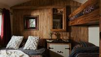 The clever design of the bedroom allows for four guests to sleep peacefully. 