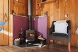 Cosy up by the wood-burner after a day of exploring. 