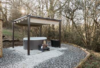 Spend sun-soaked afternoons unwinding in the the bubbling hot tub. 