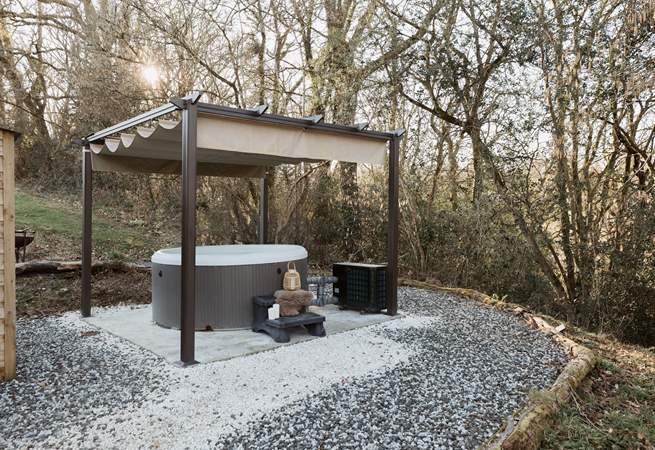 Spend sun-soaked afternoons unwinding in the the bubbling hot tub. 