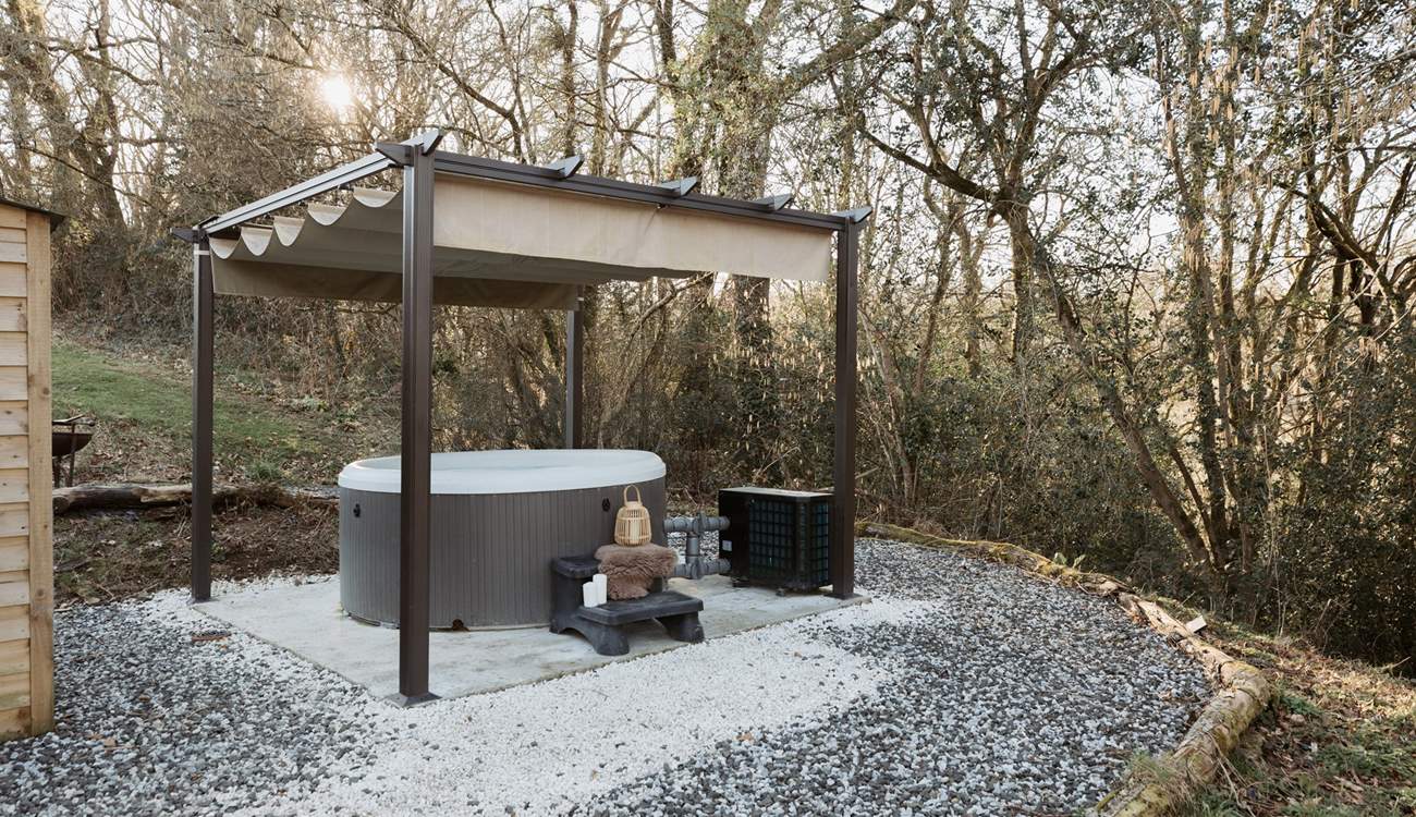 Spend sun-soaked afternoons unwinding in the the bubbling hot tub. 
