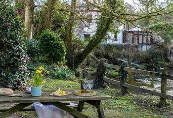 The main garden is set down by the river, accessed by the side of the garage. Please take care with young children,.