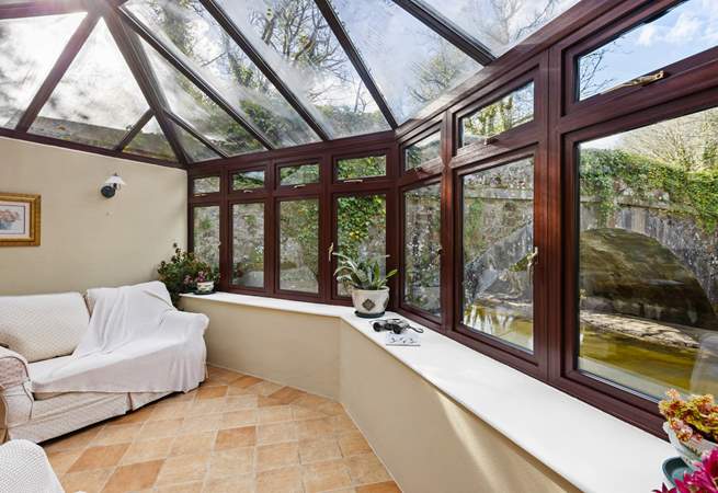 You are sure to while away many an hour in the conservatory looking out over the river.