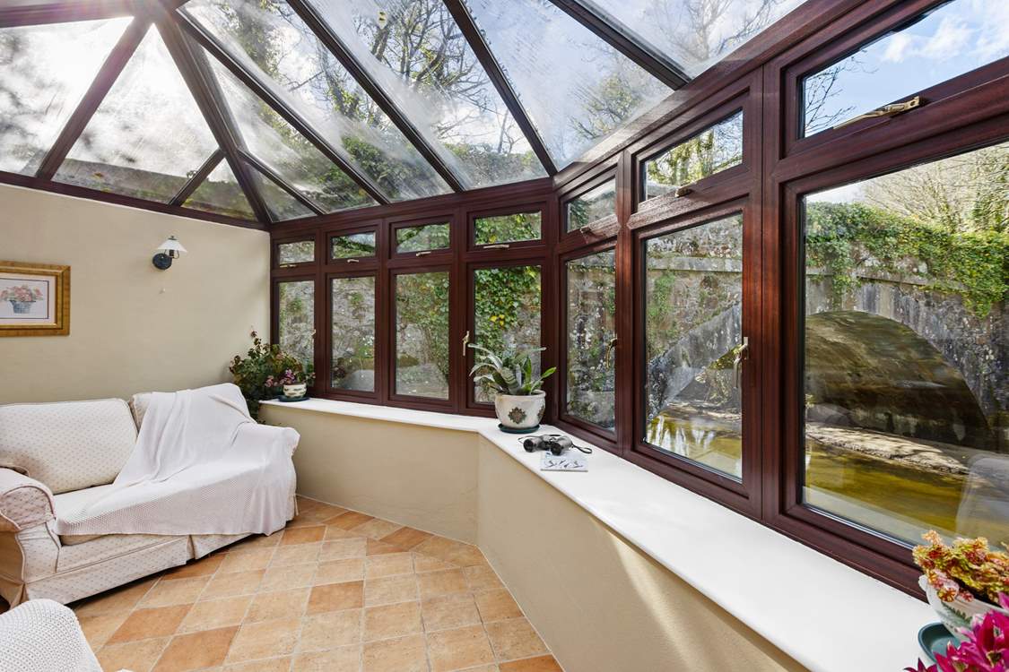 You are sure to while away many an hour in the conservatory looking out over the river.