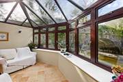 You are sure to while away many an hour in the conservatory looking out over the river.