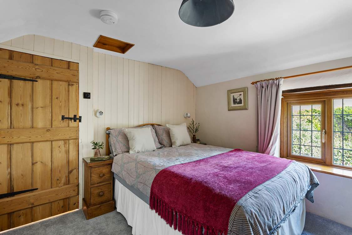 Snuggle under the covers of the double bed in bedroom 2.