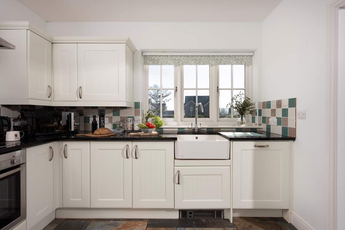 There is a beautiful Belfast sink in the kitchen.