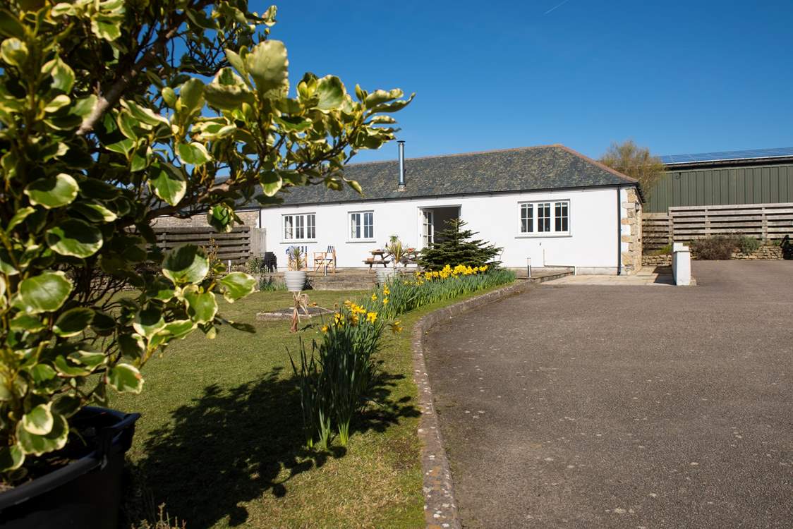 The garden puts on displays of colour year-round and there is an abundance of private parking.