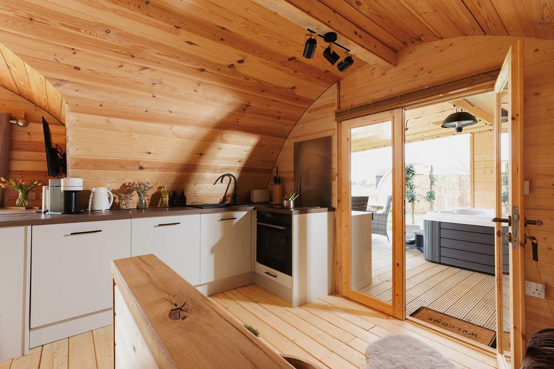 The kitchen is perfectly equipped with a full oven and dishwasher.
