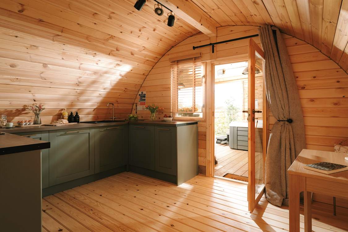 The beautiful kitchen is well-equipped with a full oven and dishwasher.