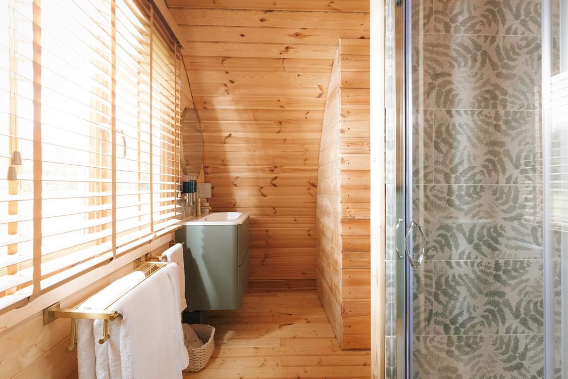 The stunning interiors flow into the spacious shower-room.