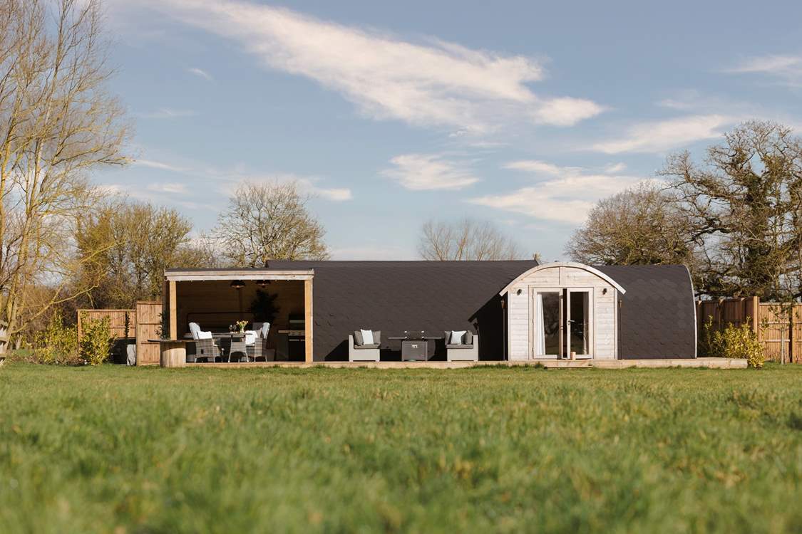 Perched in an open meadow with views of verdant countryside