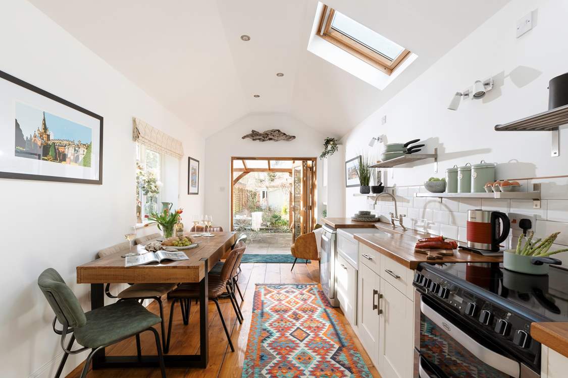 The stylish kitchen/diner leads straight out into the garden.
