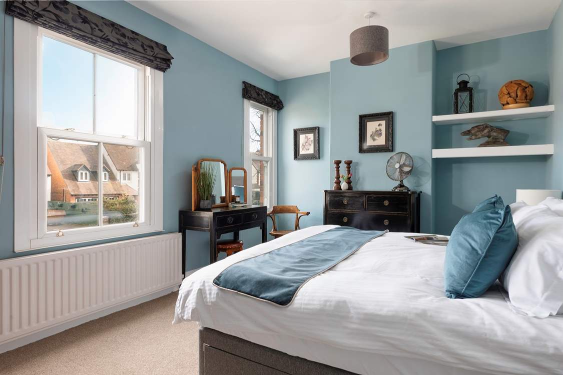 Retire to the bedroom with its comfortable bed.