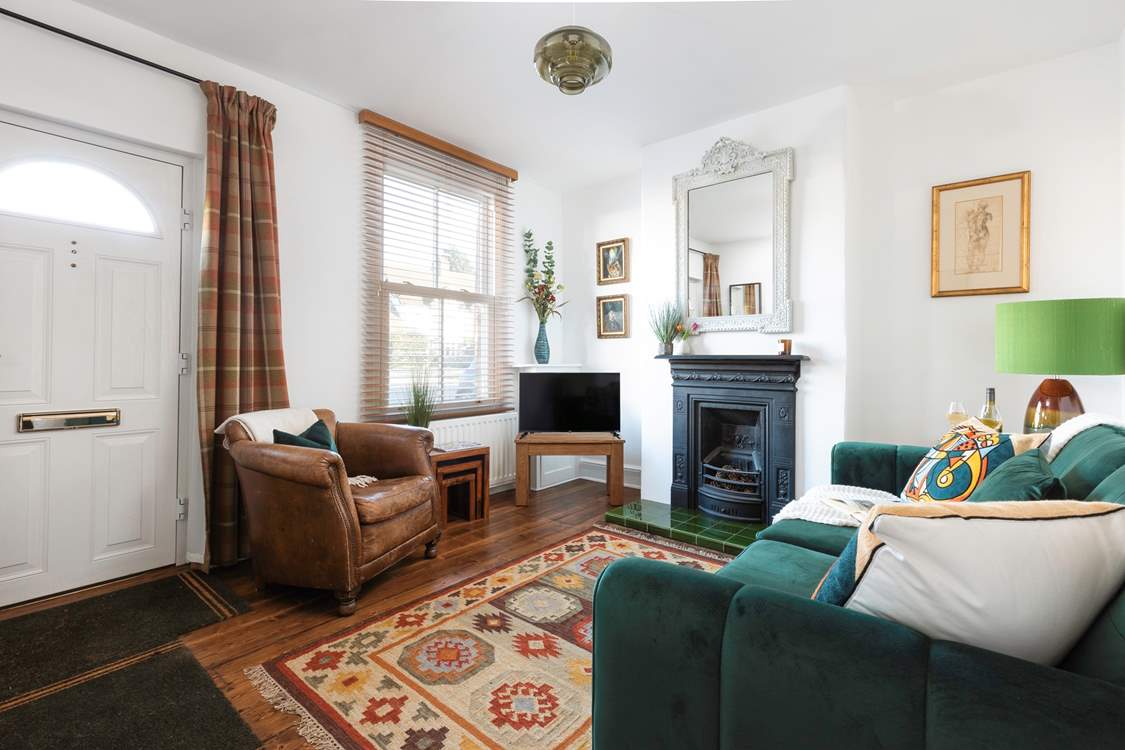 The cosy sitting-room is full of character.