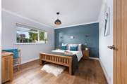 Bedroom 3 is a spacious room with a king-size bed.