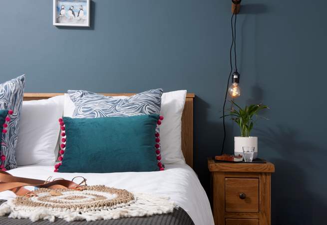 Bedroom 3 boasts marine hues. 
