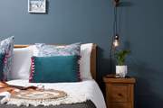 Bedroom 3 boasts marine hues.
