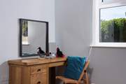 A perfectly placed dressing table or writing bureau.