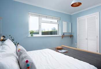 Bedroom 4 looks out over the rear garden.