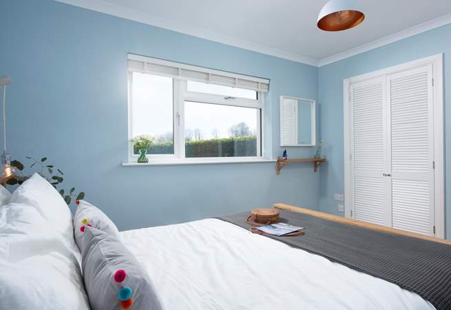 Bedroom 4 looks out over the rear garden.