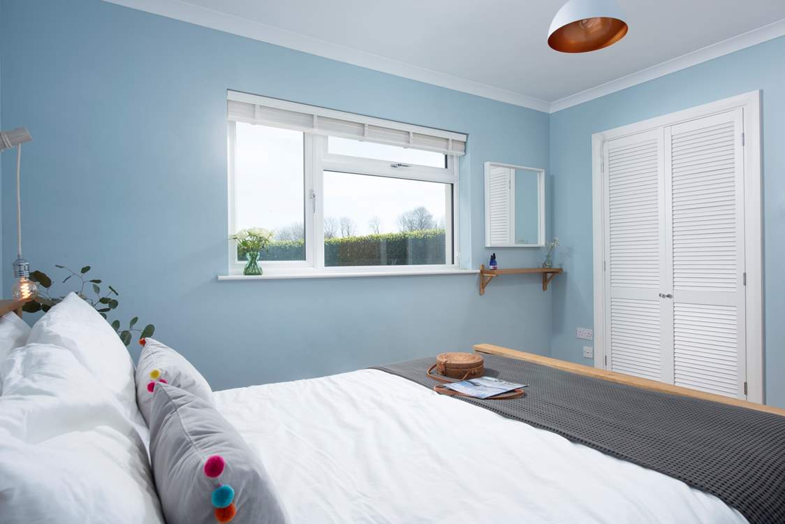 Bedroom 4 looks out over the rear garden.