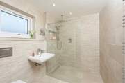 The wet-room is accessed via a small step.