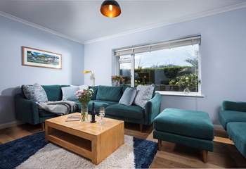 The sitting-room is stylish and homely.