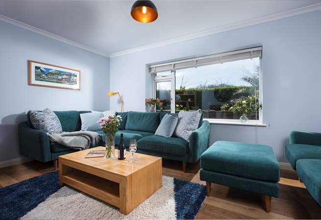 The sitting-room is stylish and homely.