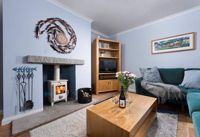 There is a cosy log-burner in the sitting-room for the cooler months.
