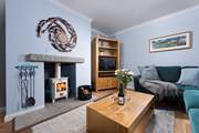 There is a cosy log-burner in the sitting-room for the cooler months.
