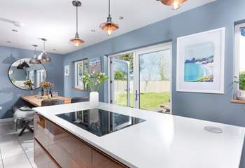 The kitchen/dining-room has enormous double doors.