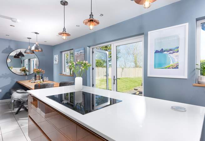 The kitchen/dining-room has enormous double doors.