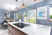The kitchen/dining-room has enormous double doors.