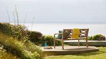 Lose yourself in the serene coastal scenery at the bottom of the garden.