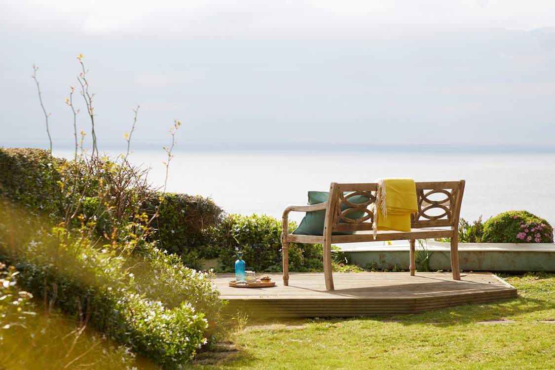 Lose yourself in the serene coastal scenery at the bottom of the garden.
