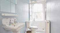A clean and bright first floor shower-room ready to awaken the senses! 
