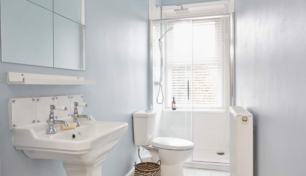 A clean and bright first floor shower-room ready to awaken the senses! 
