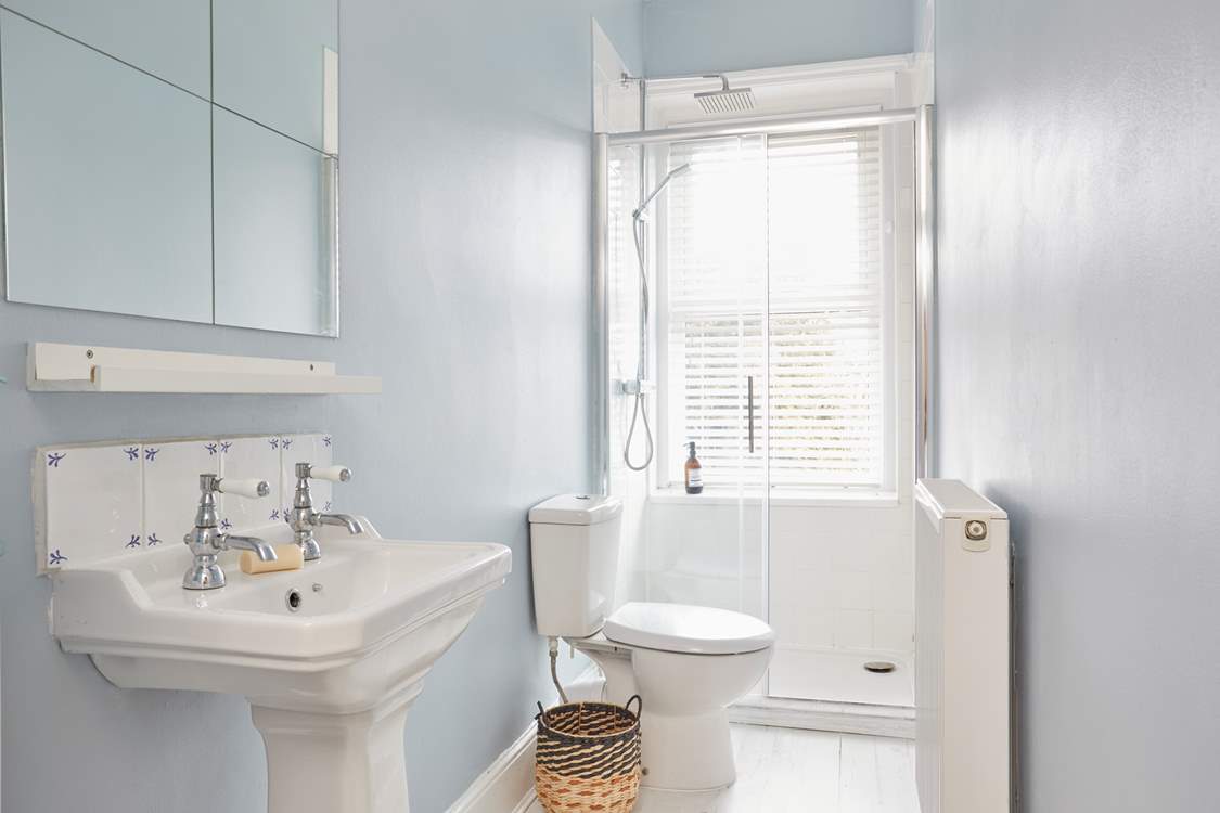 A clean and bright first floor shower-room ready to awaken the senses!