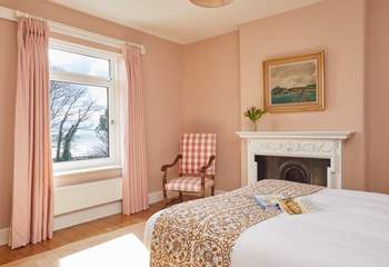 Serene slumber and glorious sea views await in this tranquil bedroom. 