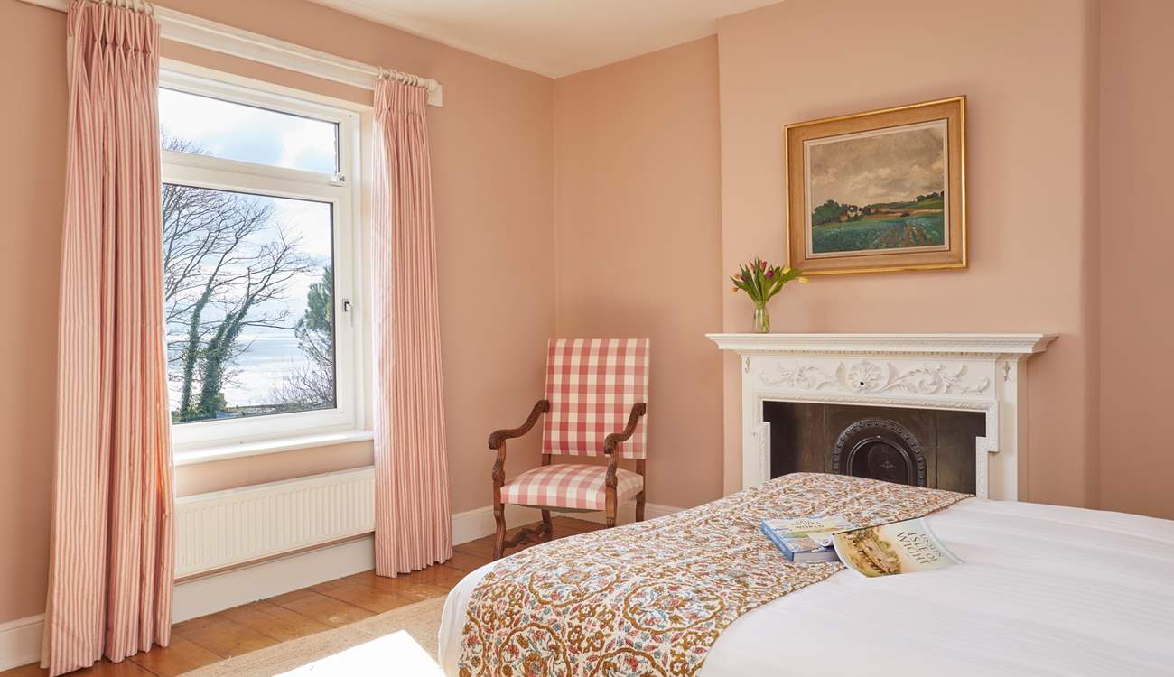 Serene slumber and glorious sea views await in this tranquil bedroom. 