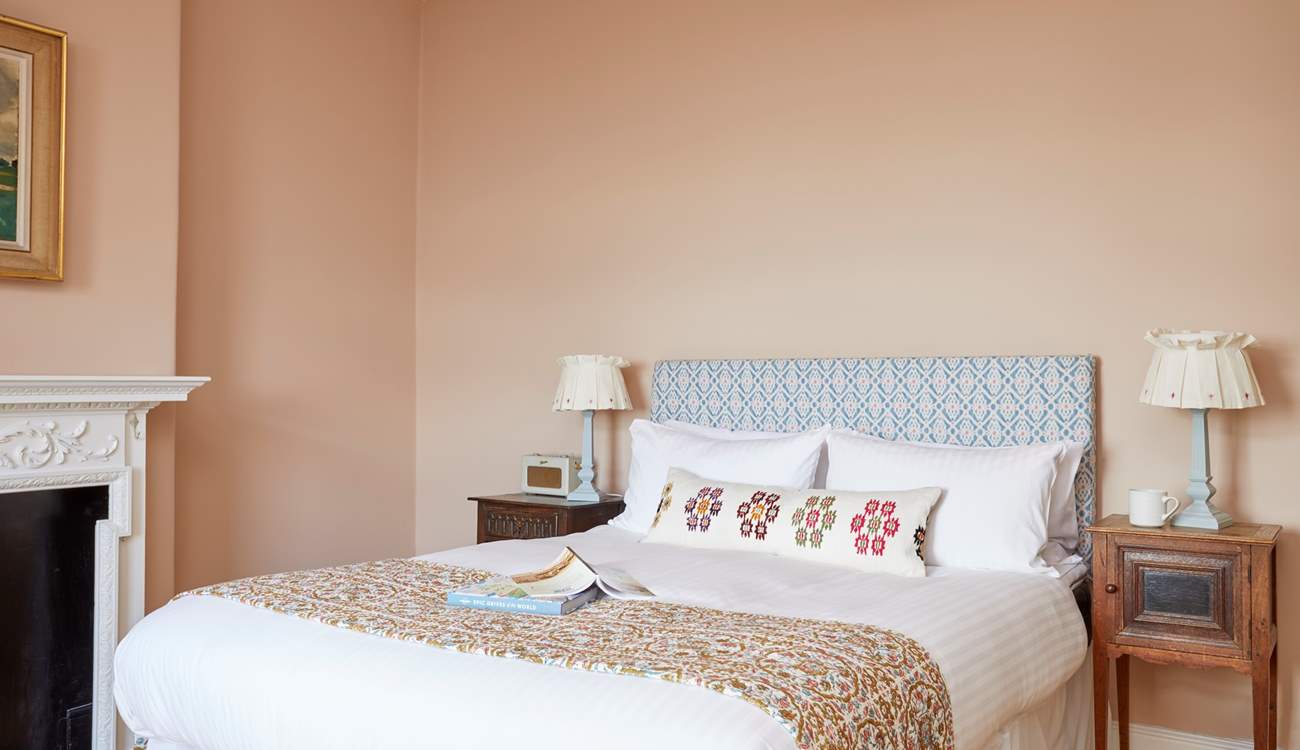 Sweet dreams await in this calming and beautifully decorated space.