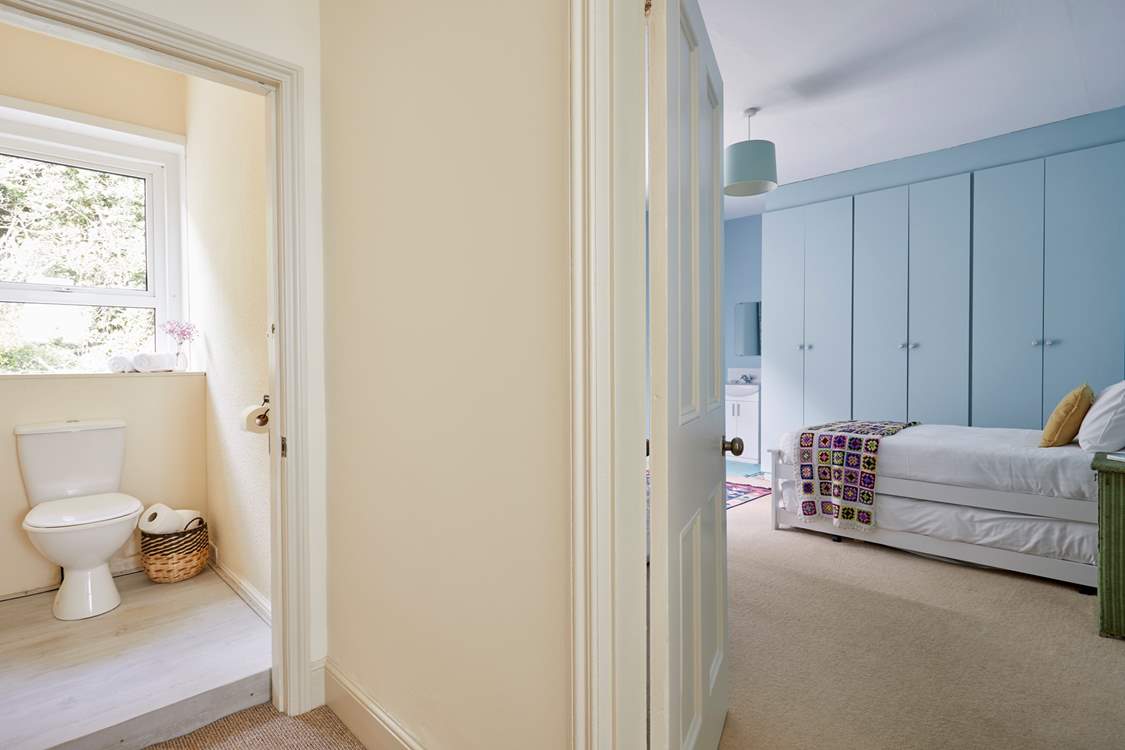 A glimpse into the handy first floor cloakroom and twin bedroom.