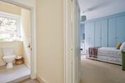 A glimpse into the handy first floor cloakroom and twin bedroom.