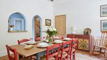 The arched openings add a touch of additional charm and a seamless connection with the kitchen. 